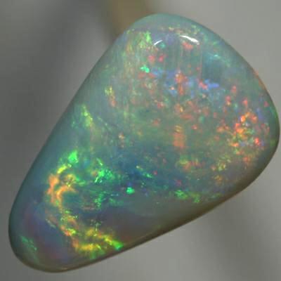 SOLID SEMI BLACK OPAL Sparkling orange moves to green rolling flashes